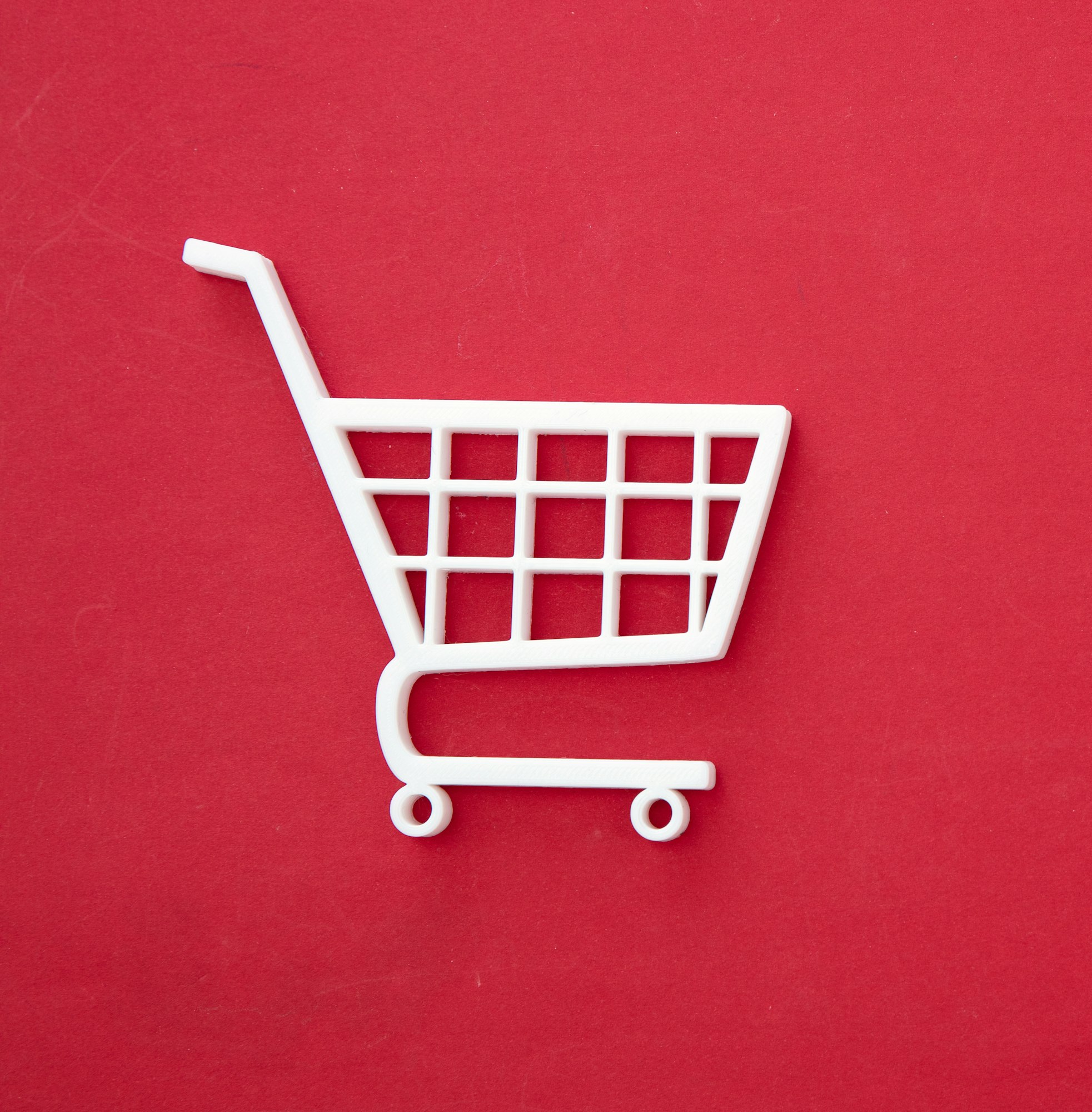 Shopping Cart icon white on red. E commerce and online shop concept