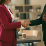 Businesswoman handshake with partner to celebration partnership and business deal concept.