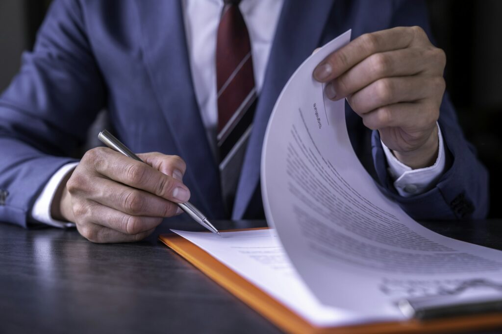 business man reading and signing a business contract, business agreement consensus signing, business